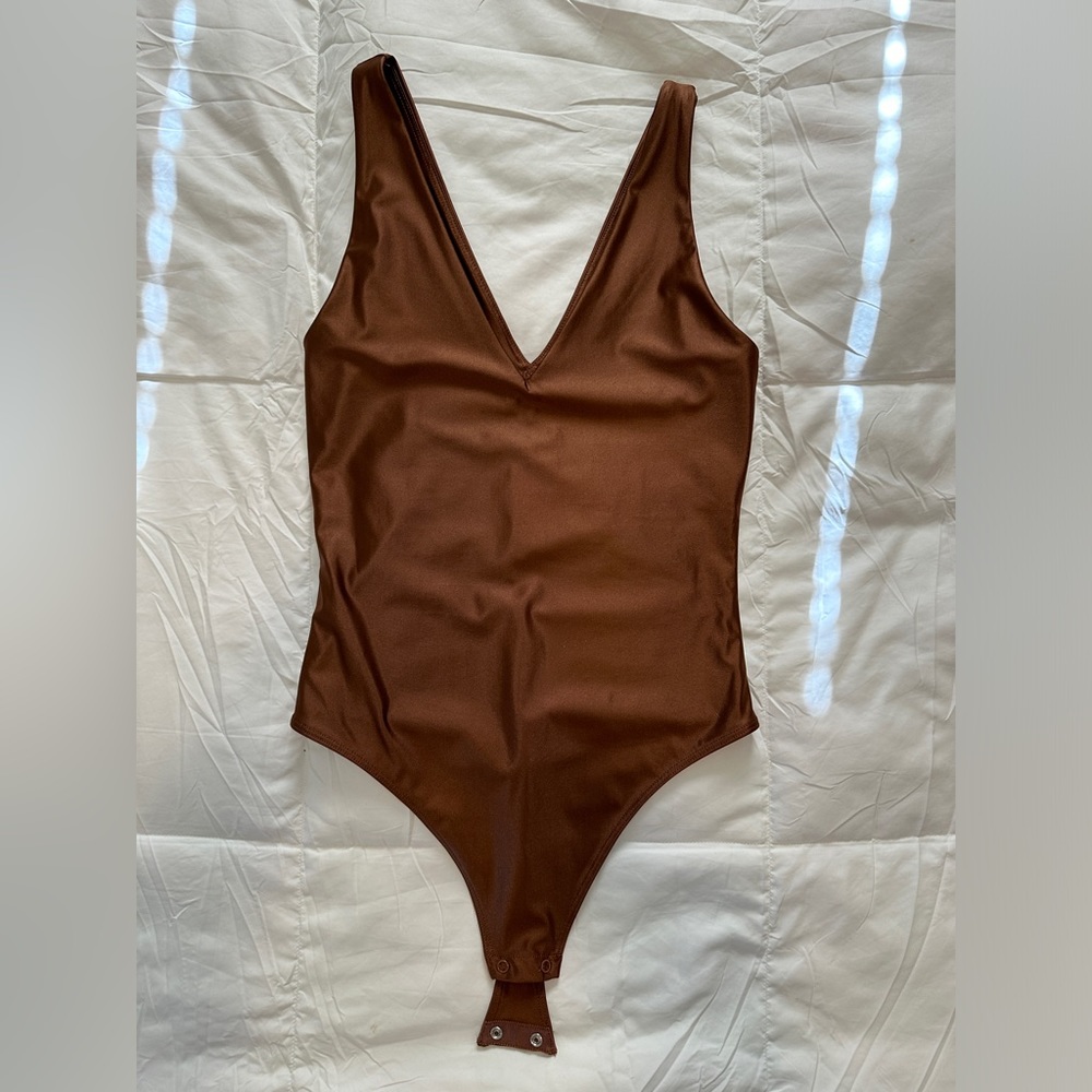 Never worn! XS Babaton Satinette v-neck bodysuit in Epicurean brown